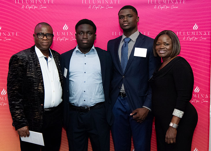 Temi, Semi and their family smiling for a photo at the 2026 Imagine Gala.