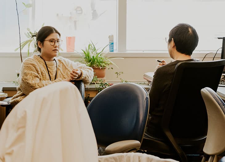 Two researchers having a conversation.