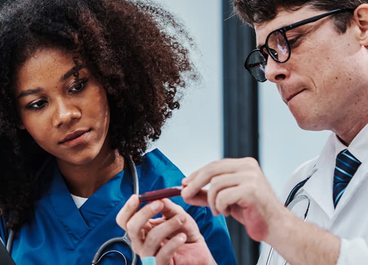 Patient talking with a physician.