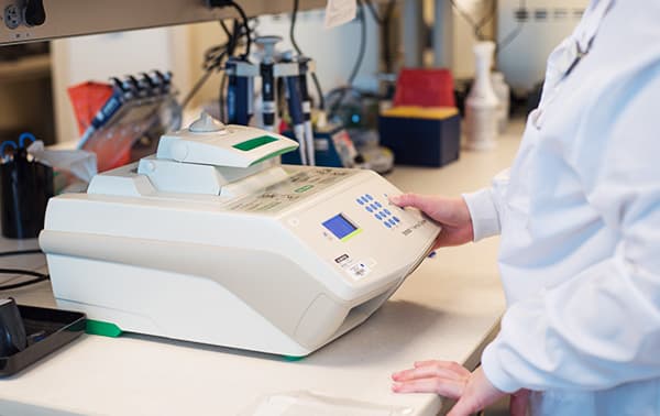Lab technician conducting genetic testing.