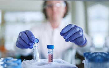 Researcher pulling some samples out of dry ice.