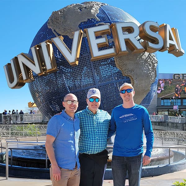 Dave and his sons, Ryan and Derek standing in front of the Univeral Studios globe.