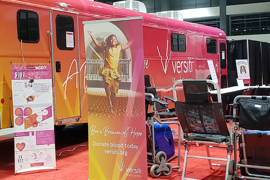 The Versiti mobile bus at the annual auto show blood drive.